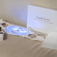 Lerelle Beauty LED therapy face mask with remote control on a surface