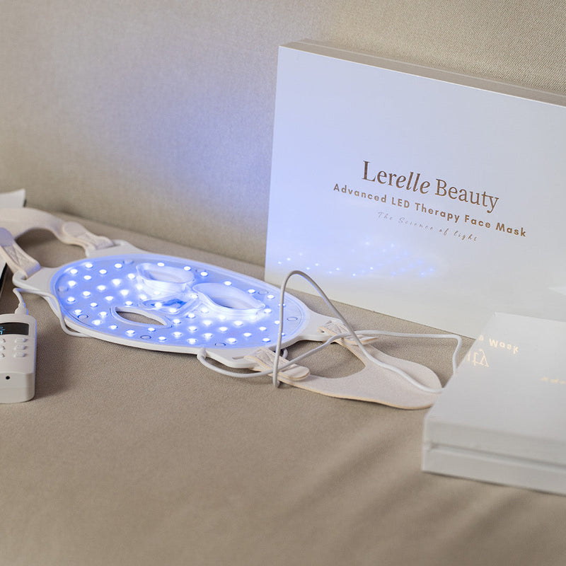 Lerelle Beauty LED therapy face mask with remote control on a surface
