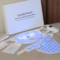Lerelle Beauty Advanced LED Therapy Mask on the couch with a branded box in the background. 