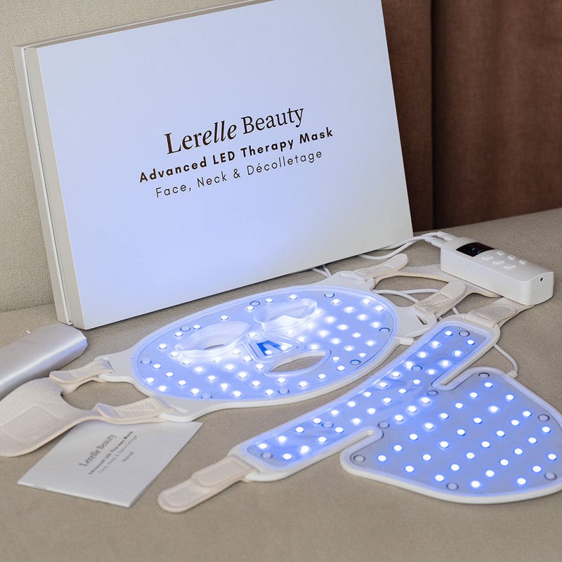 Lerelle Beauty Advanced LED Therapy Mask on the couch with a branded box in the background. 