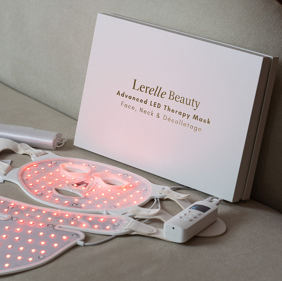 Lerelle Beauty LED therapy mask on a beige surface with packaging and accessories.
