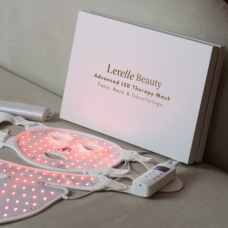 Lerelle Beauty LED therapy mask on a beige surface with packaging and accessories.