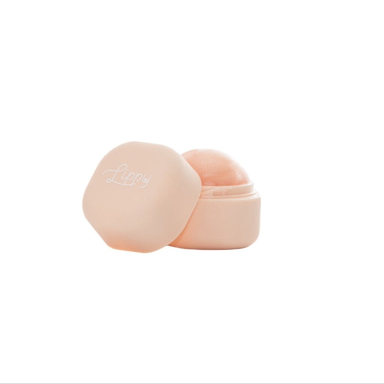 Cream lip balm container on a white background