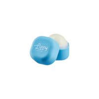 Blue lip balm container with white lip balm on a white background